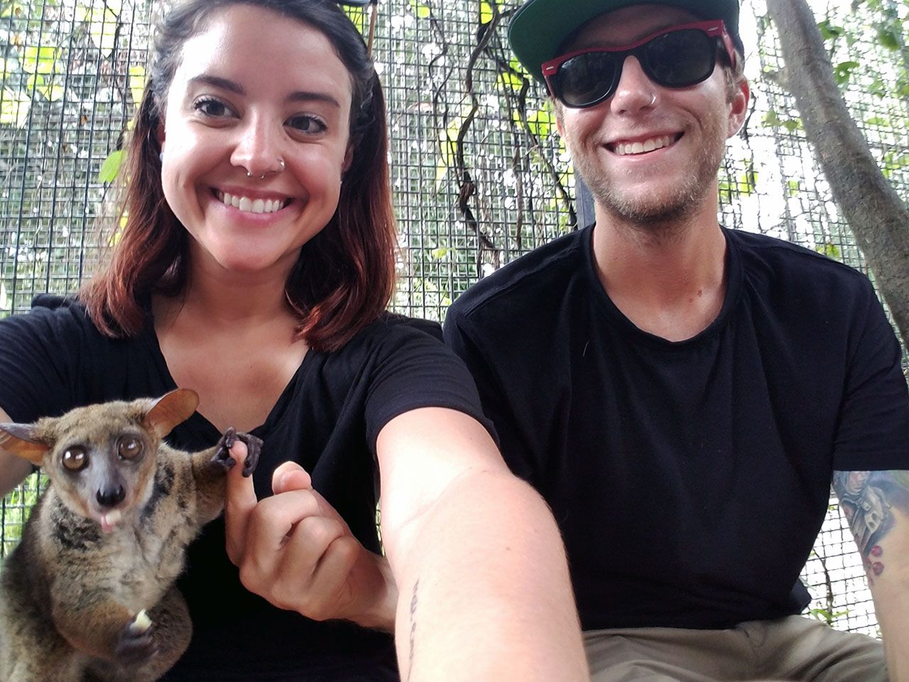 Branden with a bush baby at Cheetahs Rock in Zanzibar